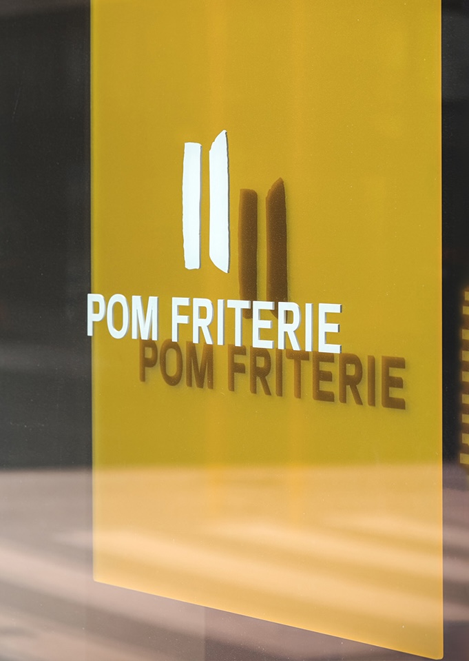Yellow Pom Friterie window signage detail