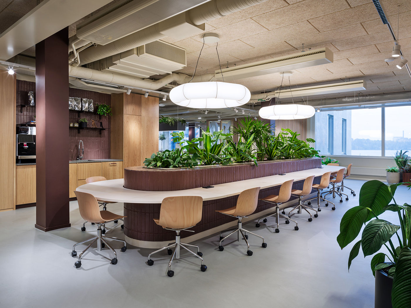 Long communal table with planted centrepiece