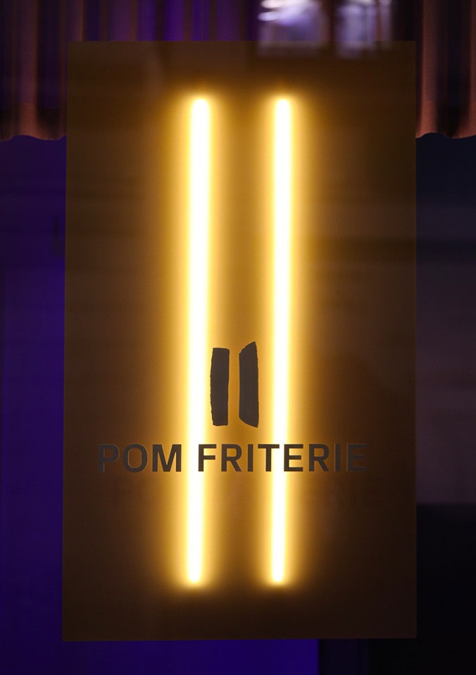 Illuminated Pom Friterie signage
