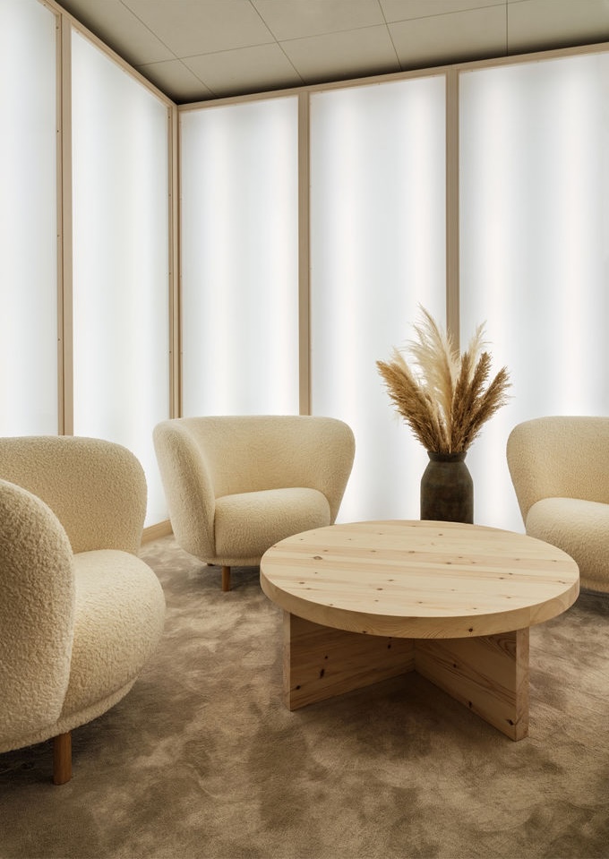 Quiet corner with bouclé chairs and pine table